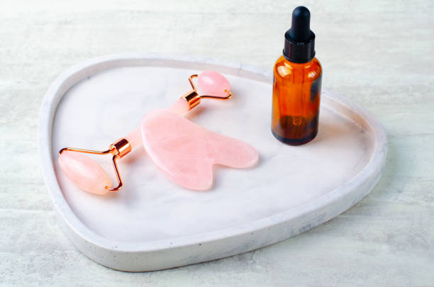 istock Rose Quartz Roller and Gua Sha tool, Facial Lifting Massage Treatment 1496786444