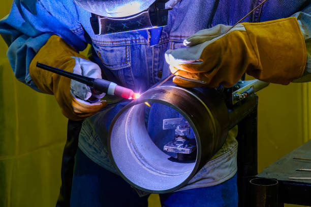 Close up scene safety welding concept with protective mask and safety glove. stock photo