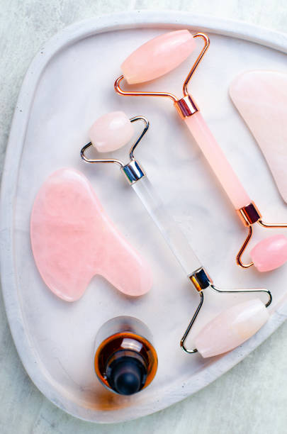 istock Rose Quartz Roller and Gua Sha tool, Facial Lifting Massage Treatment 1496786599