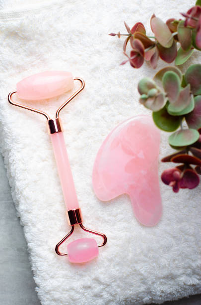 istock Rose Quartz Roller and Gua Sha tool, Facial Lifting Massage Treatment 1496786675