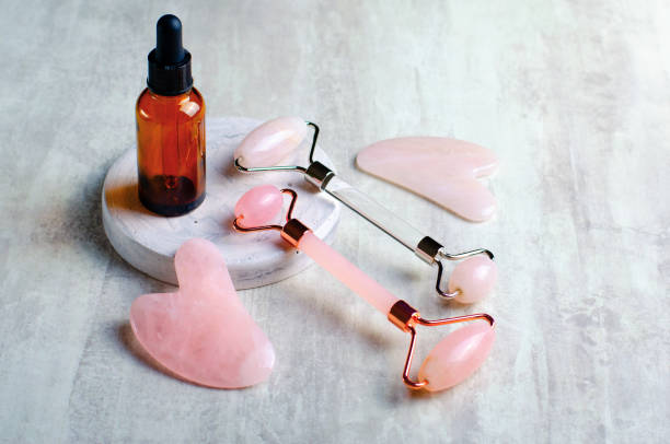 istock Rose Quartz Roller and Gua Sha tool, Facial Lifting Massage Treatment 1496786839