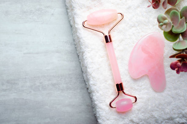 istock Rose Quartz Roller and Gua Sha tool, Facial Lifting Massage Treatment 1496787673