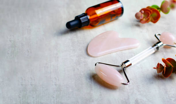 istock Rose Quartz Roller and Gua Sha tool, Facial Lifting Massage Treatment 1496787705