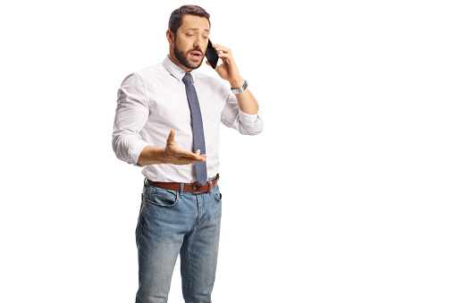 Worried professional man using a smartphone isolated on white background