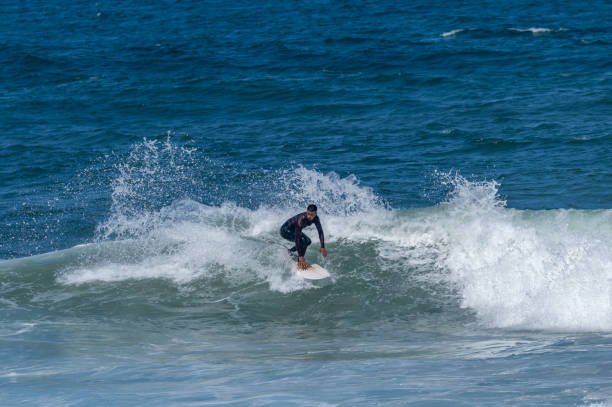 istock Surfer riding waves in Furadouro Beach 1496792285