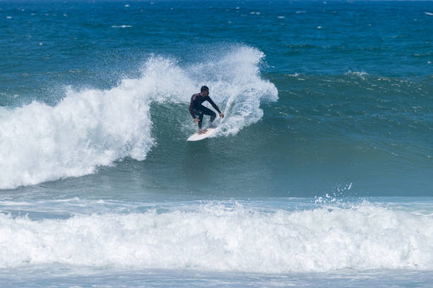 istock Surfer riding waves in Furadouro Beach 1496792293