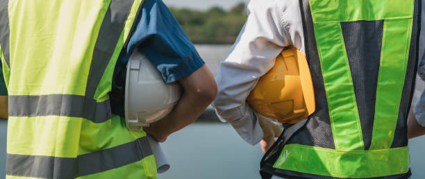 istock Close up of a Hard hat at a construction site. The safety gear for construction workers. Engineer perform quality assurance checks on the different components. 1496792988