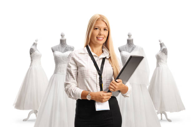 istock Wedding planner holding a clipboard at a bridal shop 1496794486