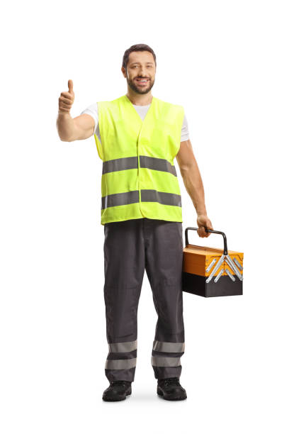 istock Road help worker in a reflective vest holding a tool box and gesturing thumbs up 1496794519