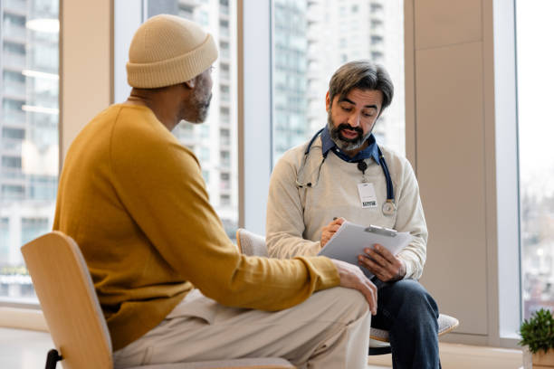 Shot of a doctor having a consultation with a patient in his office stock photo