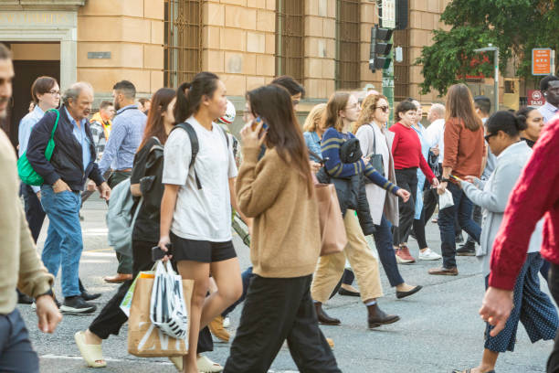 istock Crowd of commuters crossing a CBD street 1496800859