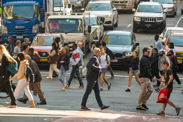 istock Crowd of commuters crossing a CBD street 1496800865