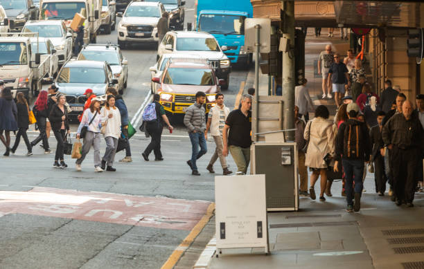 istock Crowd of commuters crossing a CBD street 1496800868