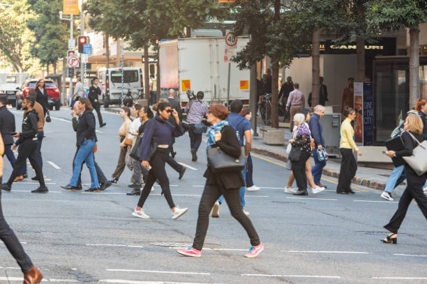 istock Crowd of commuters crossing a CBD street 1496800872