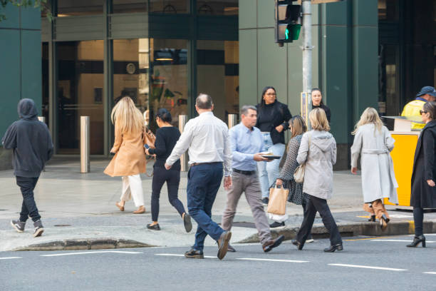 istock Crowd of commuters crossing a CBD street 1496800873