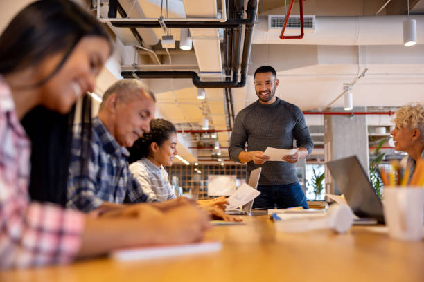 Man making a presentation to his team in a business meeting