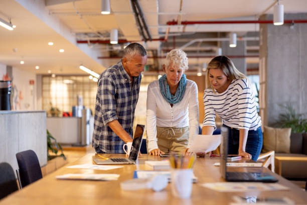istock Successful business team brainstorming together at the office 1496805617