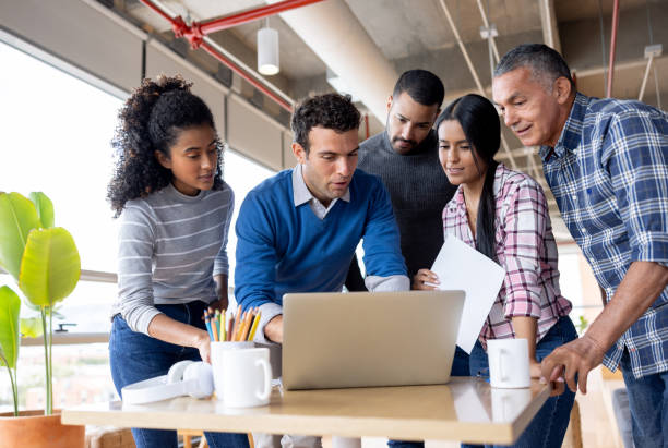 istock Businessman leading a business team while sharing ideas at the office 1496805666