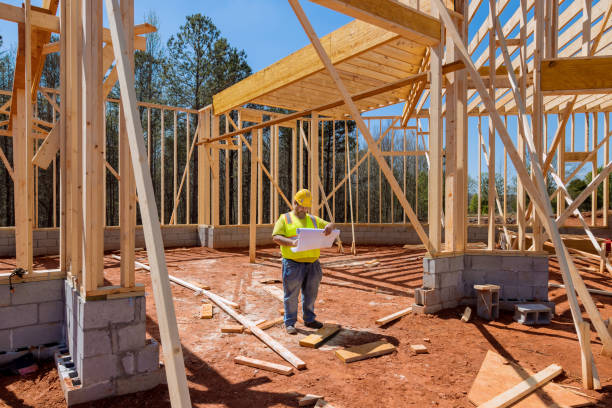 istock Construction work is being carried out at the building site by a contractor using a blueprint plan for the architecture 1496816072