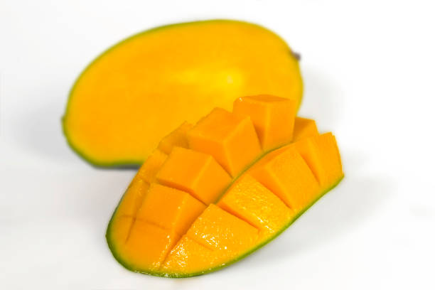 istock Sliced fresh juicy mango layed down on white, yellow organic exotic healthy fruit 1496823148