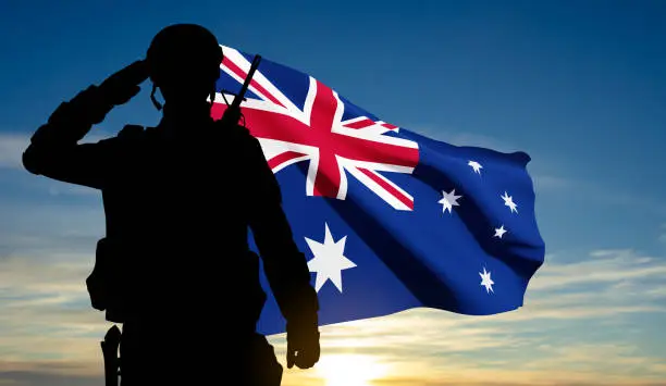 Vector illustration of Silhouette of Soldier with Australian flag on background of sunset. Concept - Armed Force