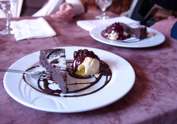 istock Chocolate cake with ice cream and fruits 1496832946