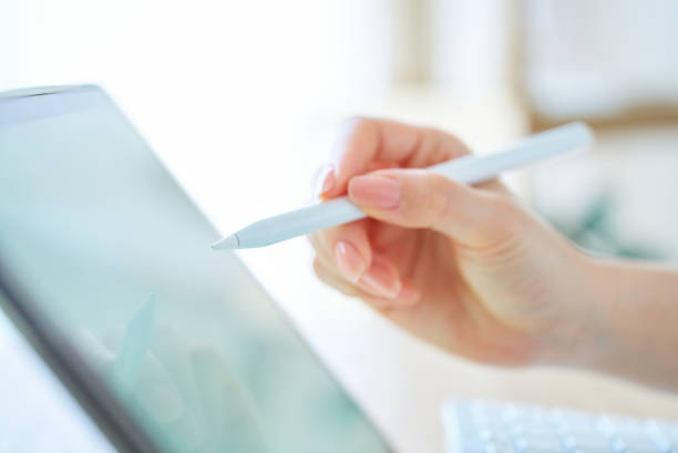 istock Woman's hand holding a stylus pen 1496833635