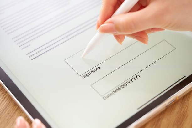 istock making an electronic signature with a stylus pen 1496834218