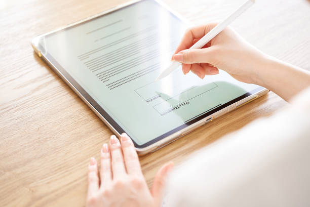 istock making an electronic signature with a stylus pen 1496834262