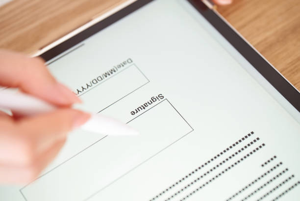 istock making an electronic signature with a stylus pen 1496834271