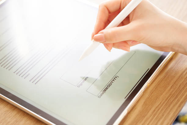 istock making an electronic signature with a stylus pen 1496834335