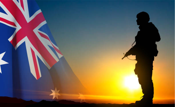 istock Silhouette of Soldier with Australian flag on background of sunset 1496838069