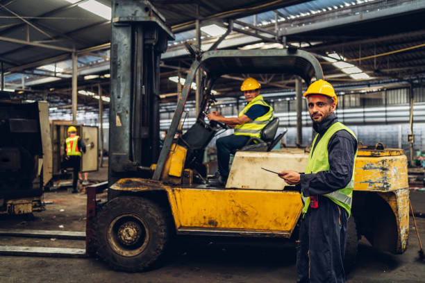 istock Workers Factory or Engineering work at factory site check up machine or products in site. Foreman or Technician checking Material or Machine on Plant. Heavy industry factory concept. 1496840941