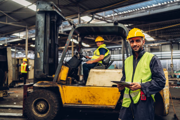 istock Workers Factory or Engineering work at factory site check up machine or products in site. Foreman or Technician checking Material or Machine on Plant. Heavy industry factory concept. 1496840947