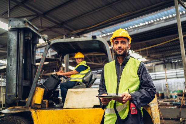 istock Workers Factory or Engineering work at factory site check up machine or products in site. Foreman or Technician checking Material or Machine on Plant. Heavy industry factory concept. 1496840959