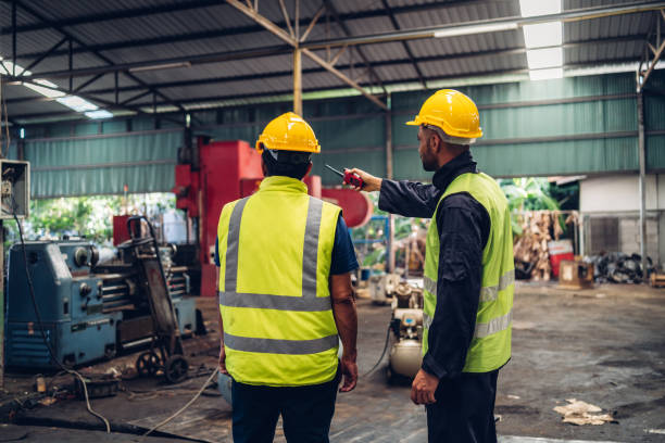 istock Workers Factory or Engineering work at factory site check up machine or products in site. Foreman or Technician checking Material or Machine on Plant. Heavy industry factory concept. 1496841033