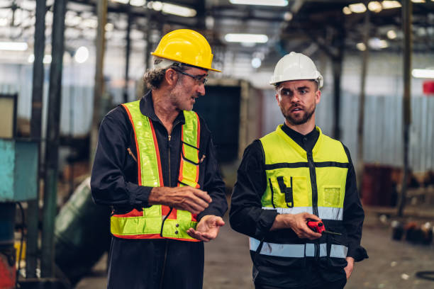 istock Workers Factory or Engineering work at factory site check up machine or products in site. Foreman or Technician checking Material or Machine on Plant. Heavy industry factory concept. 1496841073