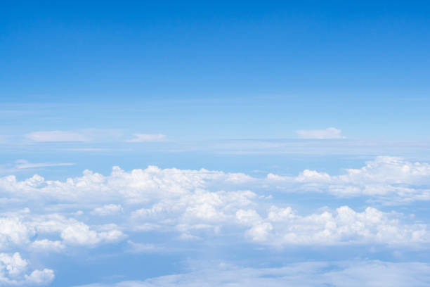 istock Aerial view of cloudscape seen through airplane window. 1496842082