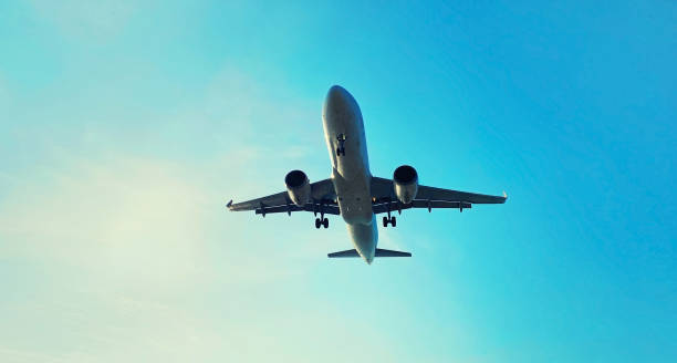istock Passenger airplane flying in blue sky 1496845453