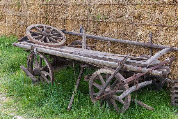 istock Old partly broken wooden four-wheeled horse-drawn rural wagon 1496845603