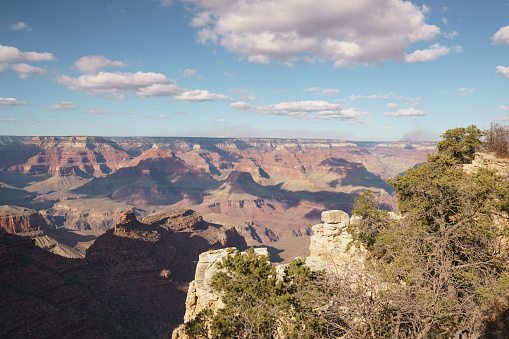 view from South Rim of Grand Canyon in sunny autumn day with white clouds, wide angle