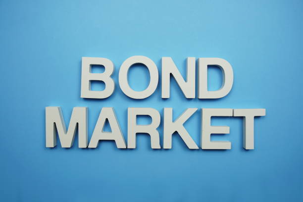 istock Bond Market alphabet letters on blue background 1496848436
