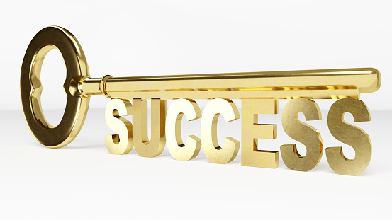 A reflective gold key symbolizes success on a white background.