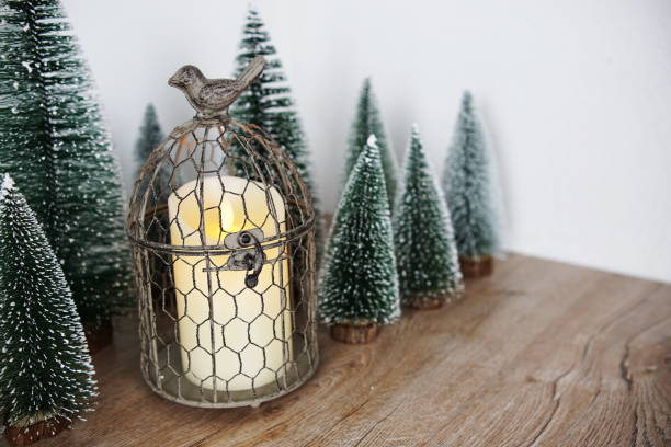 istock Christmas tree with LED candle light decoration on wooden background 1496849206