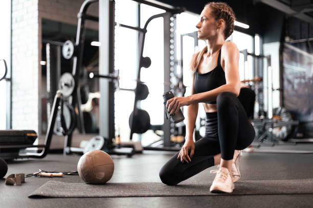 istock Sporty woman resting, having break after doing exercise. 1496849351