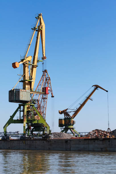 istock Portal cranes stand in port area 1496849634