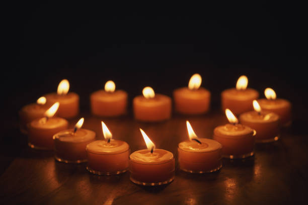 istock tea warm candles in heart shape on wood table 1496857088