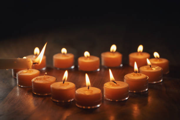 istock setting tea warm candles in heart shape on wood table 1496857168