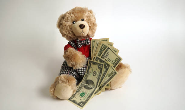 istock Teddy bear with money rich and welfare 1496858605