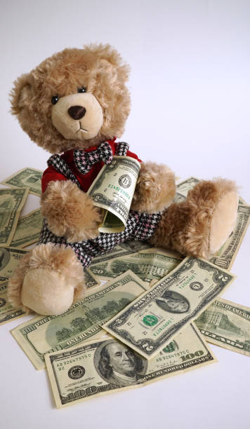 istock Teddy bear with money rich and welfare 1496858609
